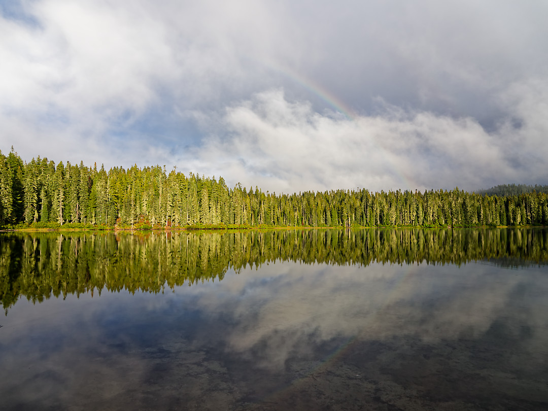 Above: Fain rainbow appears over the lake during a brief late afternoon cloud break.